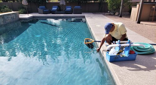 Pool attendant testing chemical levels