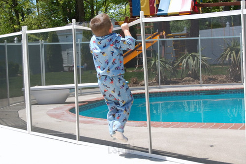 Man cleaning pool pump